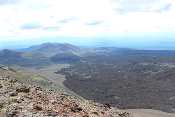 Black and red ash, valley of hills, after volcanic eruption