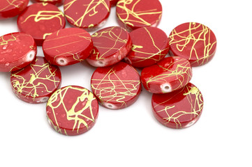 Decorative red beads scattered on white background - accessories for handmade and hobby