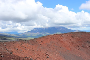 Black and red ash, valley of hills, after volcanic eruption