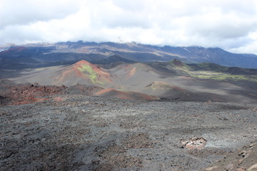Black and red ash, valley of hills, after volcanic eruption