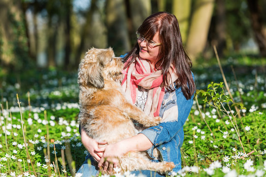 young woman and her dog between thimbleweeds