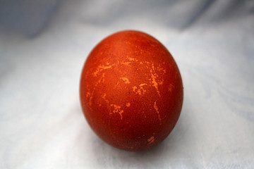 Red Easter egg, naturally dyed with onion skins. Selective focus. 