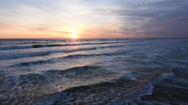 Sunset over the sea, the surf, the Black Sea, Anapa, Russia