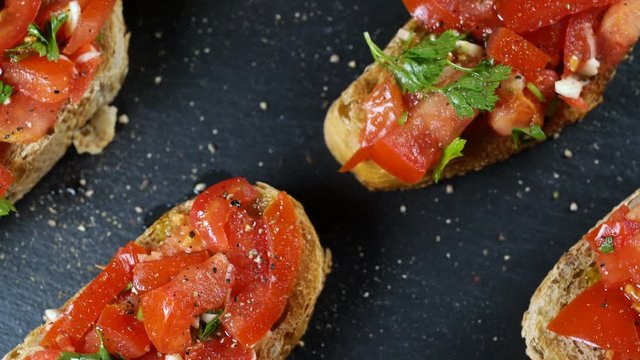 Classic Italian bruschetta, tomato, garlic and parsley on toasted bread