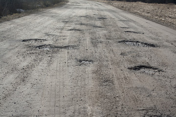 holes in asphalt road