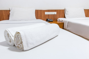 White bed and towels on the bed