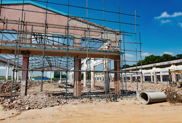 Fototapeta premium Demolition of an old building under blue sky