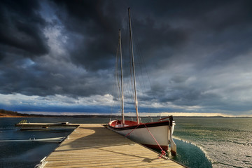 Boat on the lake at beautiful sunrise, Overblown