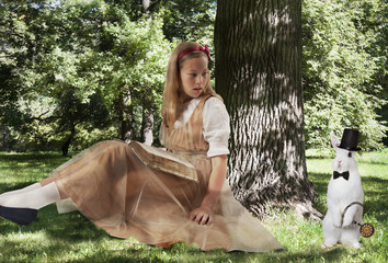 Little girl with a large white rabbit