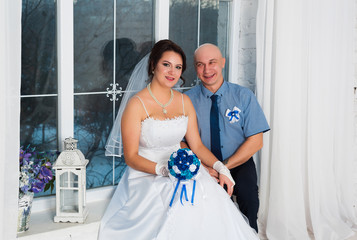 Young couple marrying and playing a wedding dress each other wedding bands and very happy