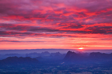 The beginning of life with the first sunlight of day from Nok Aen Cliff at Phu Kradueng National Park in Thailand