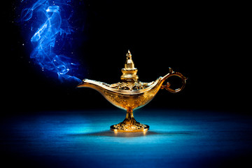Magic Aladdin / Genie lamp with smoke on a dark background - obrazy, fototapety, plakaty