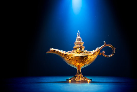 Magic Aladdin / Genie lamp on a dark background