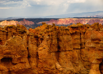Bryce Canyon National Park, a sprawling reserve in southern Utah, is known for crimson-colored hoodoos, which are spire-shaped rock formations.