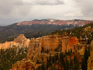 Bryce Canyon National Park, a sprawling reserve in southern Utah, is known for crimson-colored hoodoos, which are spire-shaped rock formations.