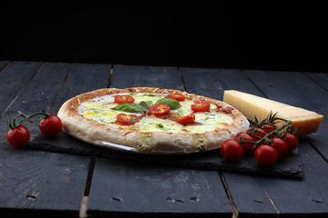 Hot true PEPPERONI ITALIAN PIZZA with salami and cheese. TOP VIEW Tasty traditional pepperoni pizza on board on wooden table with decoration