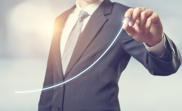Development and growth concept. Businessman plan growth and increase of positive indicators in his business.