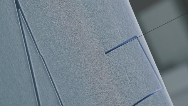 Close: Cutting plastic foam. Automatic cutting of expanded polystyrene (foam plastic). Creation of volumetric scenery from foam plastic. the creation of volumetric letters and figures of foam plastic.