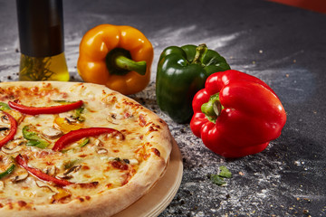 Red green yellow pepper in the kitchen black beautiful background