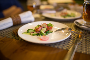 Dish with tomatoes and cucumbers in a restaurant