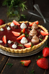 Vegan tart with chocolate and strawberry jelly