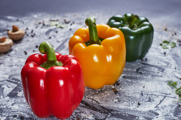 Red green yellow pepper in the kitchen black beautiful background