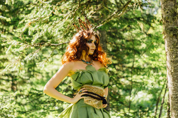 Beautiful fairy princess in summer forest