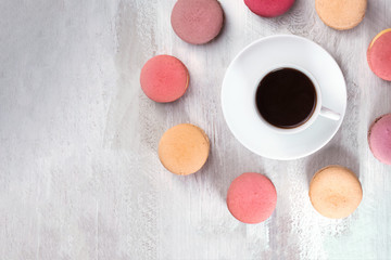 Black coffee with macarons, overhead shot