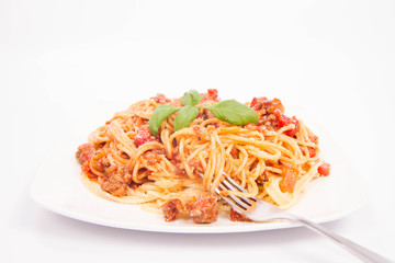 Spaghetti bolognese being eaten with a fork