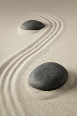 Fototapeta na wymiar zen meditation, sand and stone background texture. Spa wellness or yoga theme for concentration relaxation and spirituality...