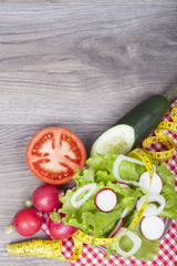 Fresh salad on a wooden background