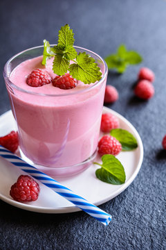 Glass of refreshing raspberry milkshake for breakfast