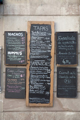 Various Spanish Menus on a Wall in Spain