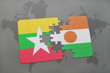 puzzle with the national flag of myanmar and niger on a world map