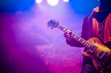 Fototapeta na wymiar guitarist on stage - summer music festival
