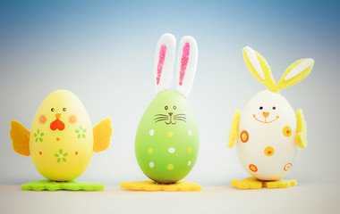 bunny and chicken shaped painted easter eggs