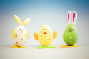 bunny and chicken shaped painted easter eggs