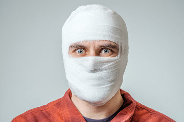 Portrait of man bandaged up