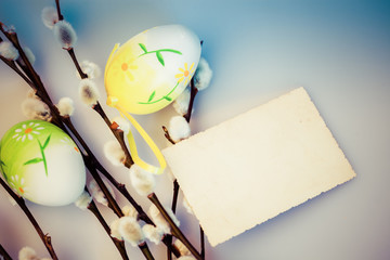 easter background with pussy-willow and colored eggs - copy space