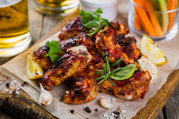 Chicken wings in on wood board