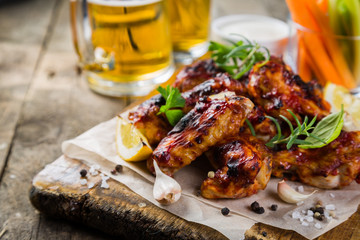 Chicken wings in on wood board