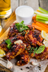 Chicken wings in on wood board