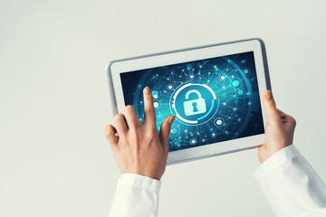 Close of female doctor hands working with tablet pc computer