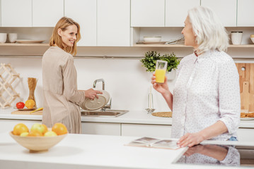 Pretty girl helping her parent in kitchen