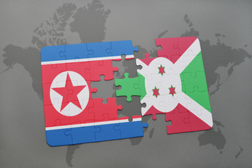 puzzle with the national flag of north korea and burundi on a world map