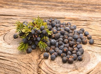 Juniper berries on a wooden background