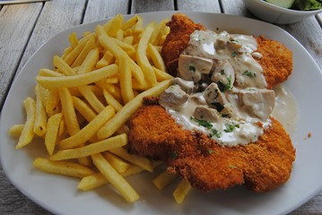 Schnitzel with mushroom sauce and french fries