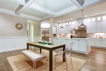 Lovely craftsman style dining space with coffered cealing