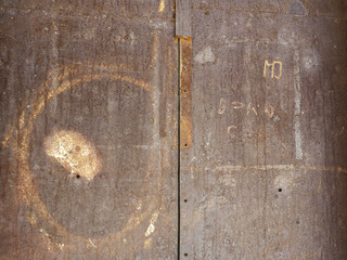Rusty iron door with scratches