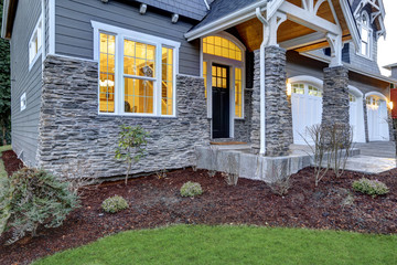 Naklejka premium Front covered porch design with stone columns